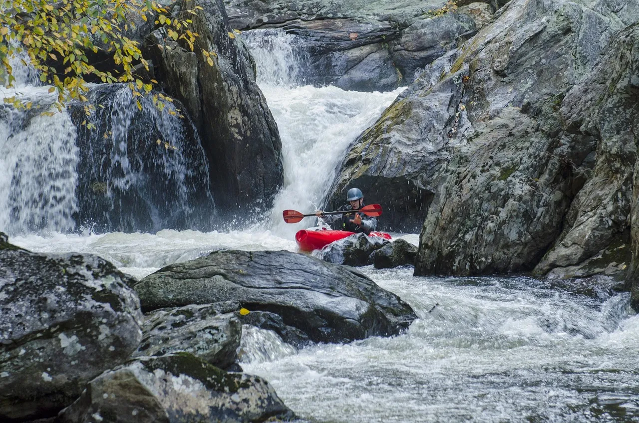 Whitewater Kayaker Navigating Drops
